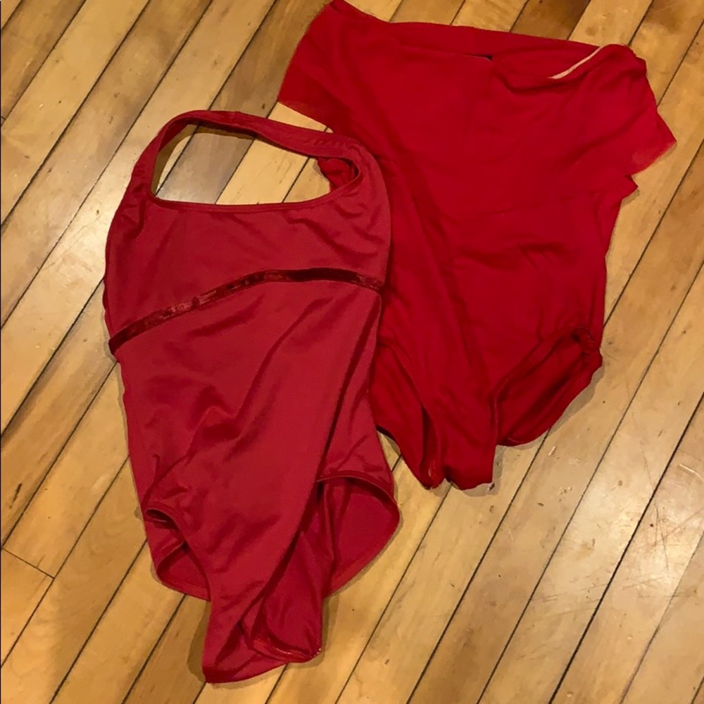 Two red ballet leotards.